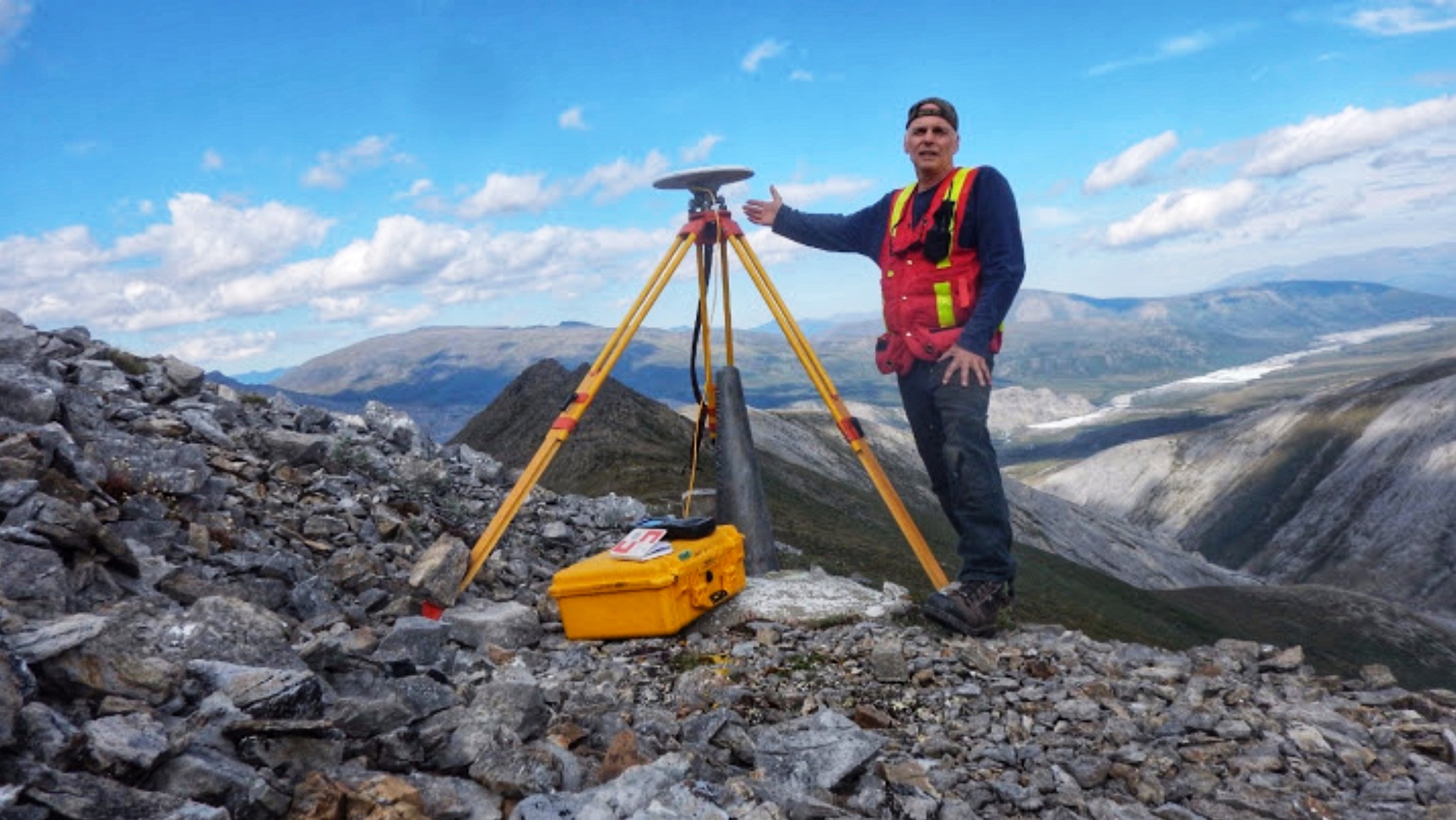 Joe records the coordinates of the Canada–United States boundary with a GNSS receiver at the Yukon–Alaska border. 